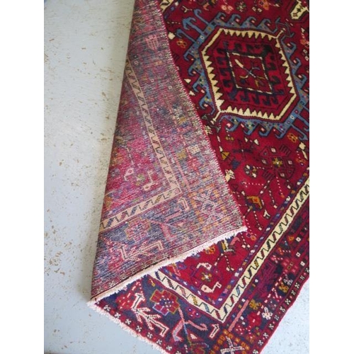 255 - A hand knotted woollen Karajeh rug, 3.05m x 1.15m, in good condition