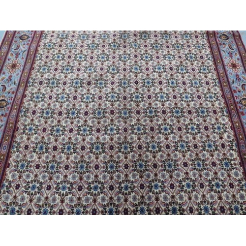 258 - A hand knotted woollen Mood rug, 2.86m x 2m, in good condition