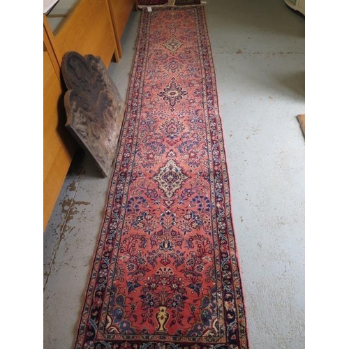 260 - A hand knotted woollen Sarough rug, 3.9m x .80m in good condition