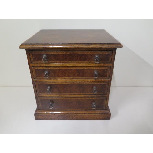28 - A small walnut four drawer / trinket chest, made by a local craftsman to a high standard, 26cm tall ... 