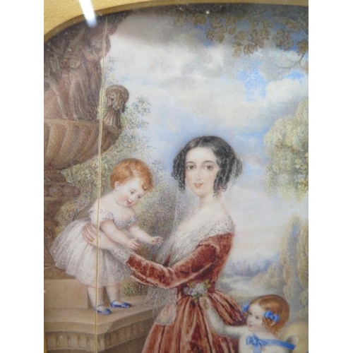 342 - A finely painted watercolour of a beautiful young lady and her two children, signed E J Carillo, in ... 