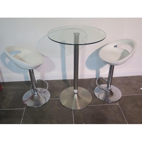 38 - A glass top bar table, 91cm tall, with two moulded white seats gas lift stools, some usage marks but... 