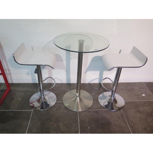 40 - A glass top bar table, 91cm tall x 60cm diameter with two white laminated gas lift stools, some usag... 