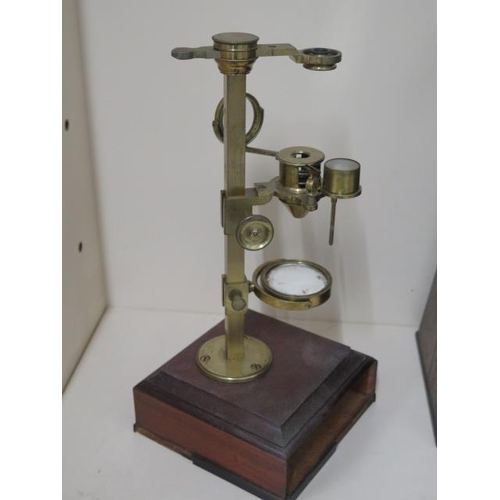 402 - A Georgian brass part microscope possibly Dolland but un named ,with various fittings housed in a ma... 