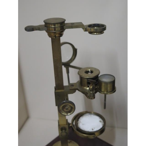 402 - A Georgian brass part microscope possibly Dolland but un named ,with various fittings housed in a ma... 