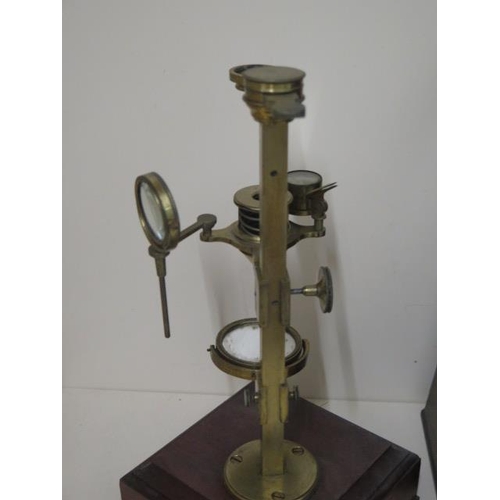 402 - A Georgian brass part microscope possibly Dolland but un named ,with various fittings housed in a ma... 