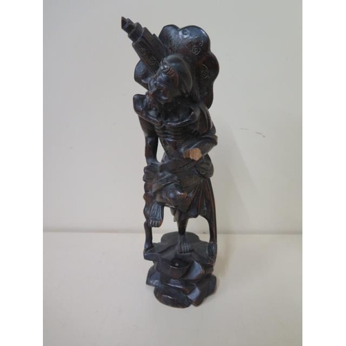 404 - Two Oriental carved rootwood figures, one with white metal inlay, 60cm  and 59cm tall, both with goo... 