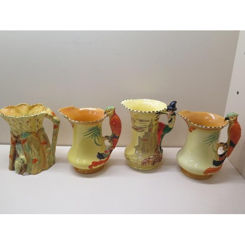 410 - Four Burleigh ware jugs, rabbit jug crazed and chipped, piper jug crazed and cracked, the other othe... 