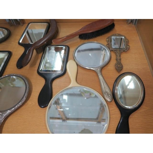 420 - A collection of 16 hand mirrors and brushes