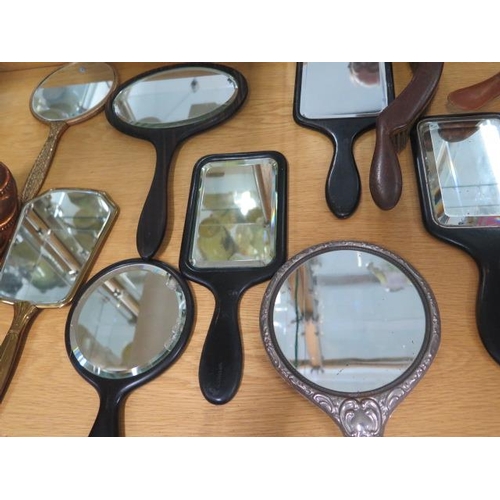 420 - A collection of 16 hand mirrors and brushes