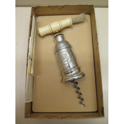 426 - A Tomason type corkscrew, boxed with instructions in very good condition, some staining to box