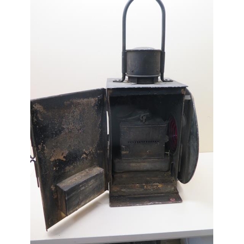 430 - A Railway train or buffer lamp with burner, 55cm tall, with age related wear, paintwork appears orig... 