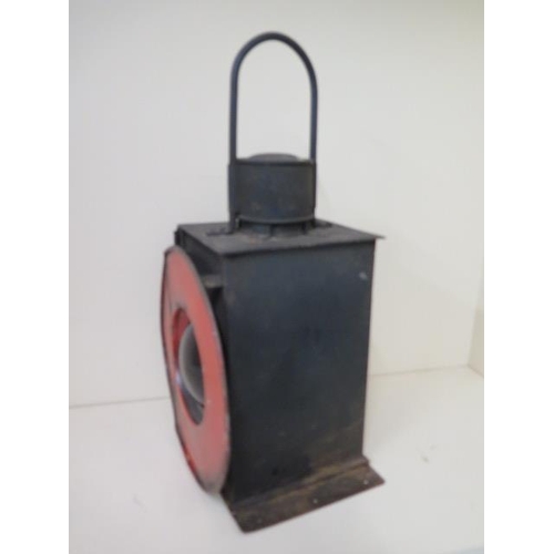 430 - A Railway train or buffer lamp with burner, 55cm tall, with age related wear, paintwork appears orig... 