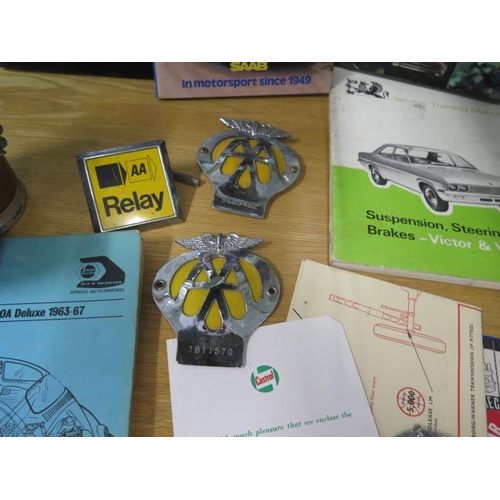 437 - Motoring Interest: VW workshop manual books, an early RAC badge, three AA badges and a motorist lamp