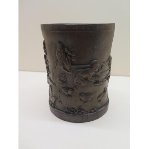 447 - A Chinese 19/20th century bamboo brush pot depicting children and animals at play, signature to one ... 