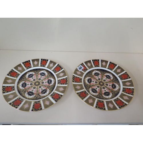 460 - A pair of Royal Crown Derby Imari pattern 1128, 27cm diameter plates, both second quality but in goo... 