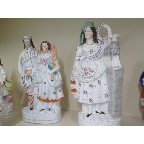 466 - A collection of eight Staffordshire figures, tallest 41cm high, all have crazing with some small col... 