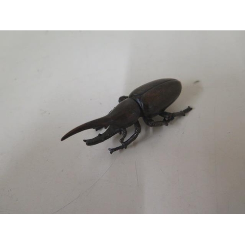 472 - A bronze beetle, 8cm long