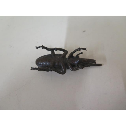 472 - A bronze beetle, 8cm long