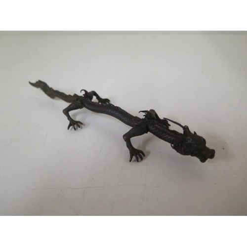 473 - A bronze dragon, 15cm long