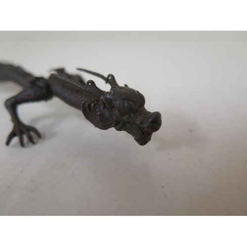 473 - A bronze dragon, 15cm long