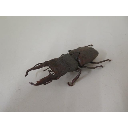 477 - A bronze beetle, 14cm long