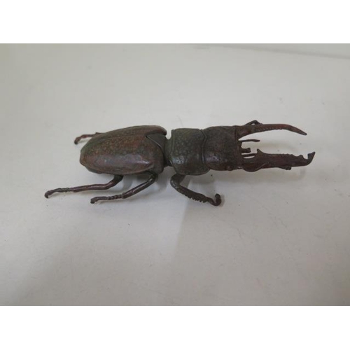 477 - A bronze beetle, 14cm long