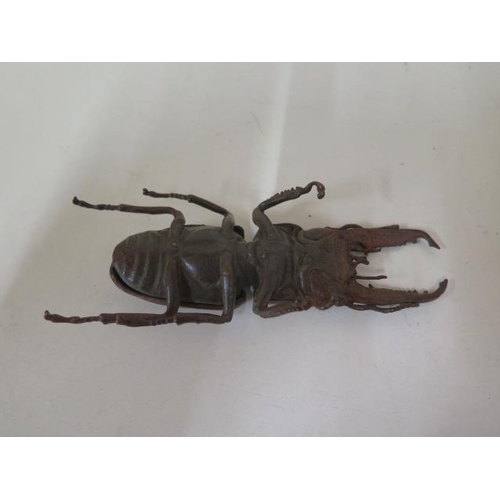 477 - A bronze beetle, 14cm long