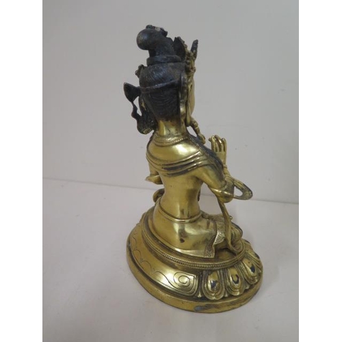 486 - A gilt bronze buddha, 20cm tall