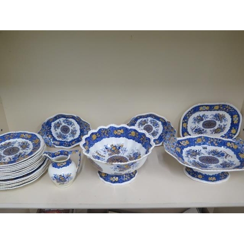 490 - A 19th century spode 'Trophy' pattern part dinner service, foliate decorated with a yellow and blue ... 