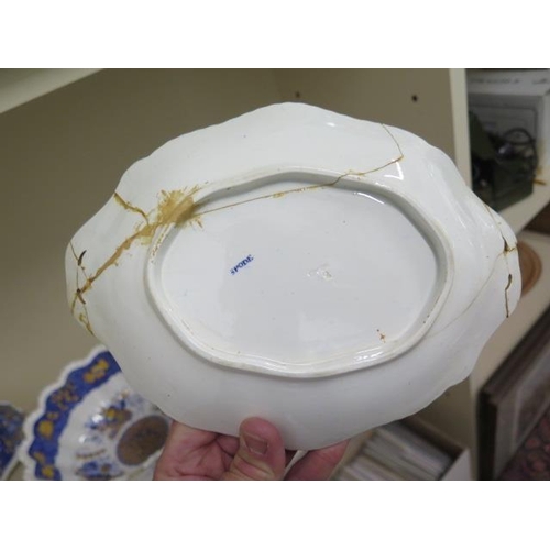 490 - A 19th century spode 'Trophy' pattern part dinner service, foliate decorated with a yellow and blue ... 