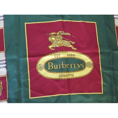 496 - A Burberrys silk scarf, c.1980, detailed with classic check and equestrian knight against a green gr... 