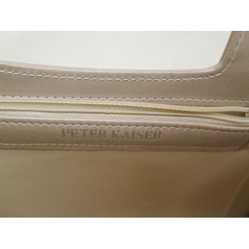 500 - A Peter Kaiser leather clutch bag with strap, 26cm wide, with a Russell and Bromley dust cover, gene... 