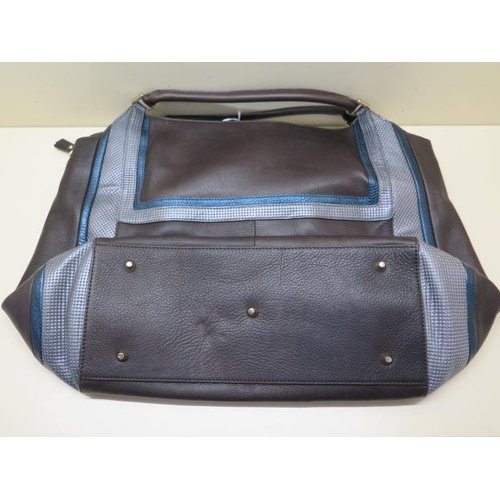 502 - A Anya Hindmarch brown, grey and blue leather bag with inside pockets, 40cm wide, some small amount ... 