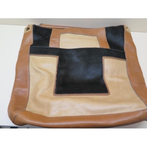 504 - A Anya Hindmarch, a tricolour leather bag, 40cm wide, some usage but generally good condition