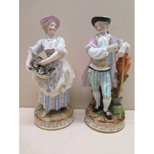 509 - A pair of continental porcelain figures, early 20th century, modelled as gallant and flower seller c... 