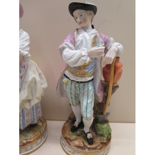 509 - A pair of continental porcelain figures, early 20th century, modelled as gallant and flower seller c... 