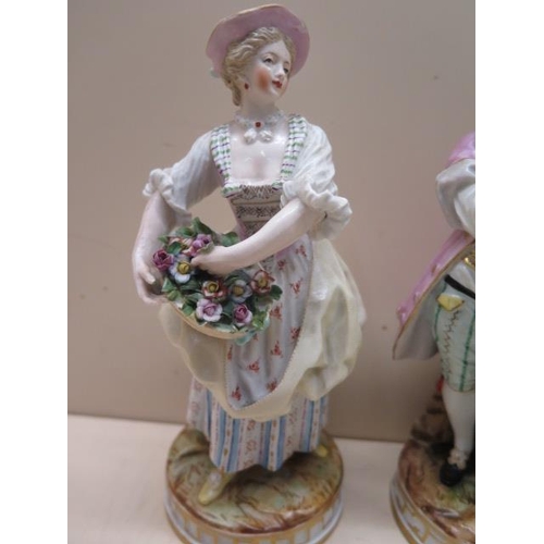 509 - A pair of continental porcelain figures, early 20th century, modelled as gallant and flower seller c... 