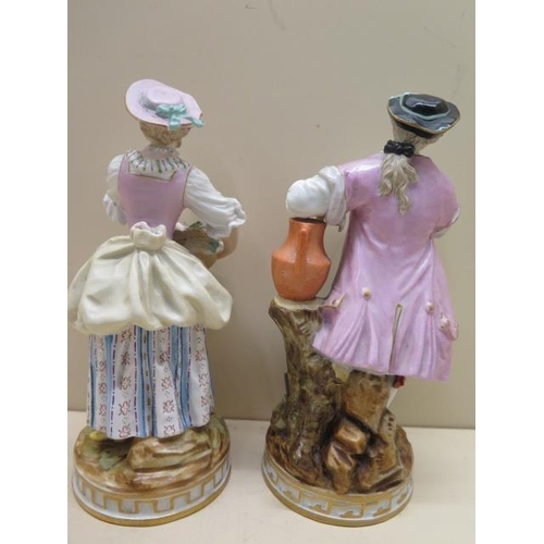 509 - A pair of continental porcelain figures, early 20th century, modelled as gallant and flower seller c... 