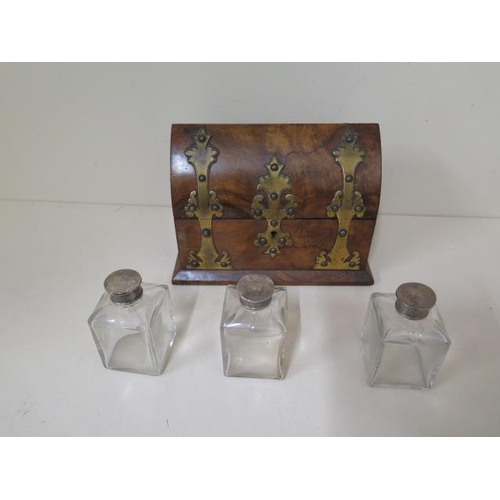 516 - A burr walnut Victorian steeple top perfume casket with brass mounts, lined interior, with three whi... 