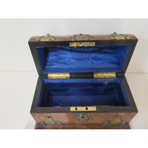 516 - A burr walnut Victorian steeple top perfume casket with brass mounts, lined interior, with three whi... 