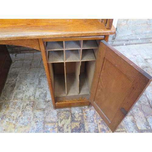 52 - A 1930s oak rolltop twin pedestal four drawer desk with fitted interior, 117cm tall x 122cm wide x 7... 