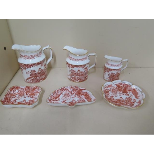 523 - A set of three graduating Royal Crown Derby Red Aves jugs, tallest 12 cm, and three side dishes, all... 