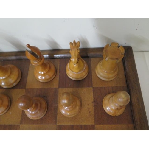 524 - A weighted chess set and board, height of King 10.5cm, board 47cm x 47cm, all good apart from slight... 