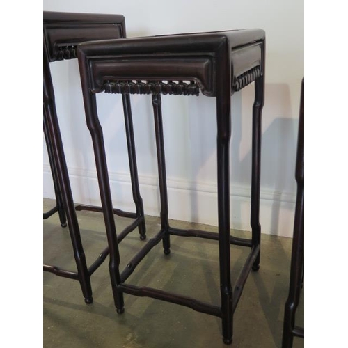57 - A nest of three Oriental carved sidetables in good sturdy condition, minor cracking to tops, 67cm ta... 