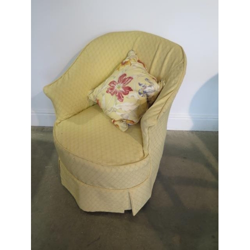 61 - An Edwardian upholstered bedroom chair with a yellow loose cover, generally good, one replacement ca... 