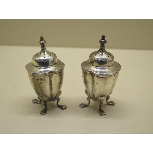 613 - A pair of silver peppers, 8cm tall, 2.65 troy oz, both generally good with some rubbing