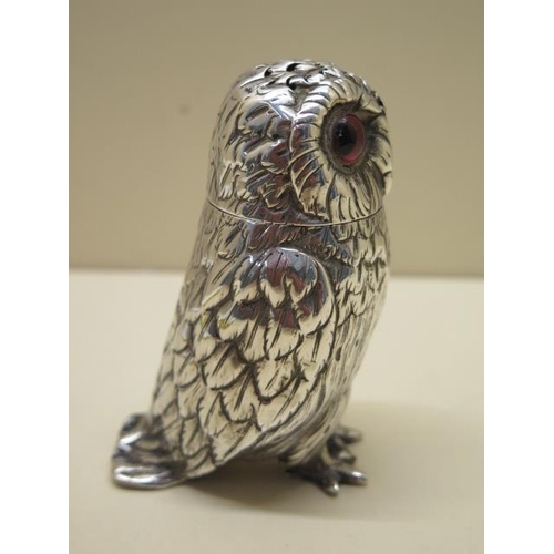 618 - A Victorian novelty silver owl pepper by George Richard and Edward Brown London 1862/3, 10cm tall, a... 