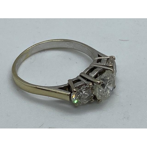 701 - An impressive 18ct white gold three stone diamond ring, the centre stone approx 1.9ct, side stones a... 