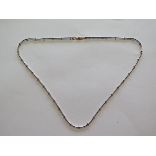 703 - A 9ct yellow and white gold necklet, 46cm long, approx 10 grams, in good condition and clasp working... 